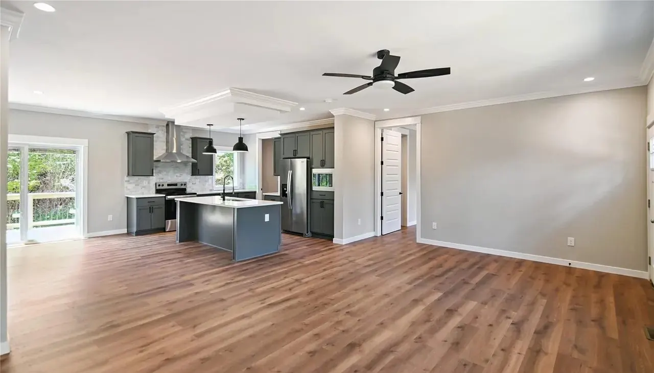 Open-concept living room and kitchen in a new Hart Homes build